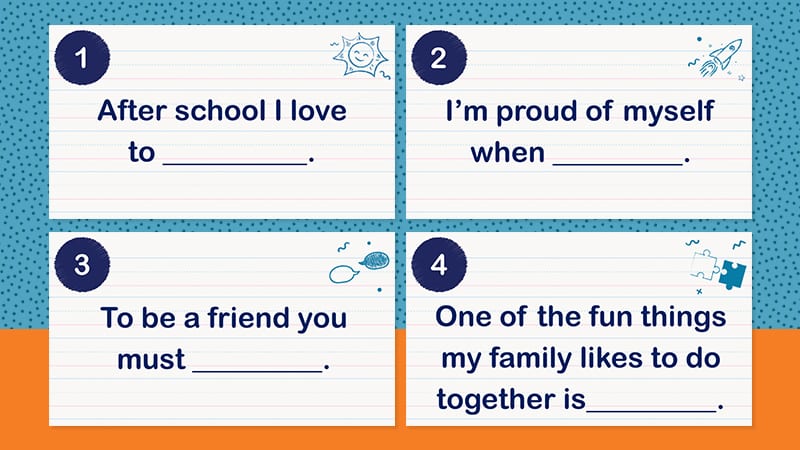 Four printed note cards of first grade writing prompts.