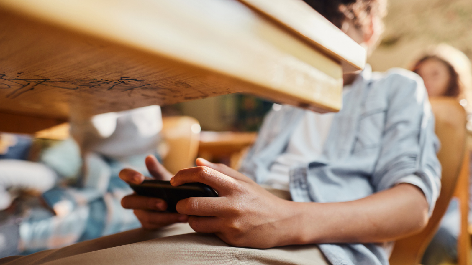 Photo of texting teen to show how phones are hurting kids