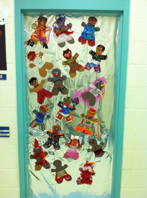 Holiday classroom doors include this one decorated with foil to look like a baking pan, with individually decorated gingerbread men
