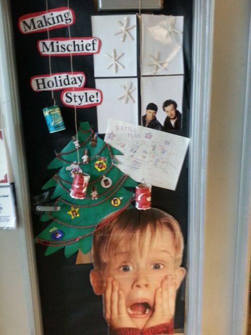 Classroom door decorated with images from the movie Home Alone, with text reading "Making Mischief Holiday Style"- holiday classroom doors