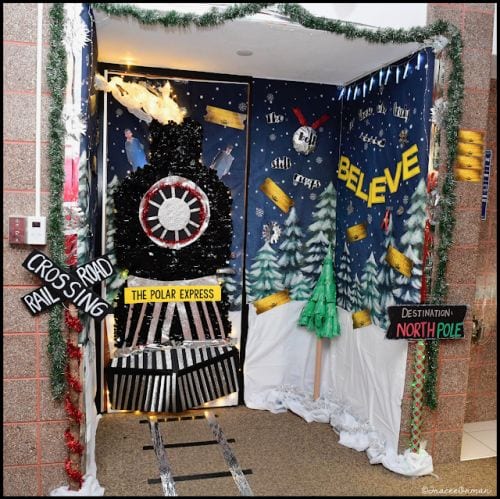 Winter classroom doors include this one that is decorated to look like a train like the polar express.