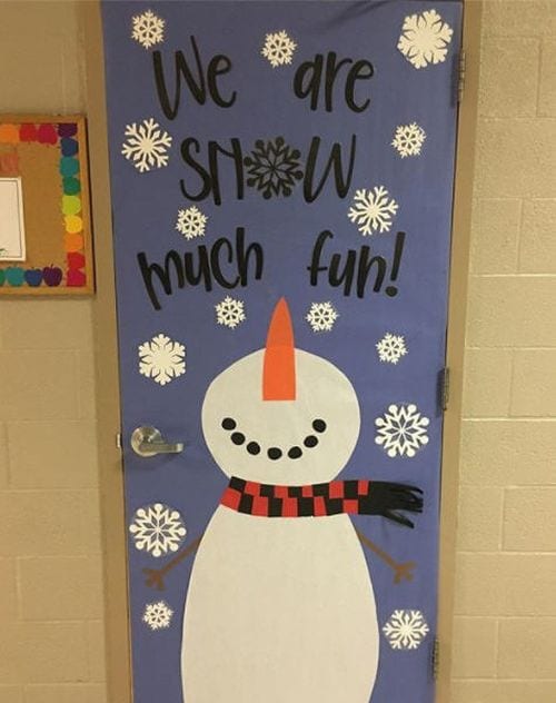 Classroom door decorated with snowman looking up, with text reading We are Snow much fun