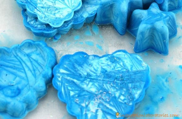 Blocks of blue oobleck frozen into heart and star shapes (Winter Science Experiments)