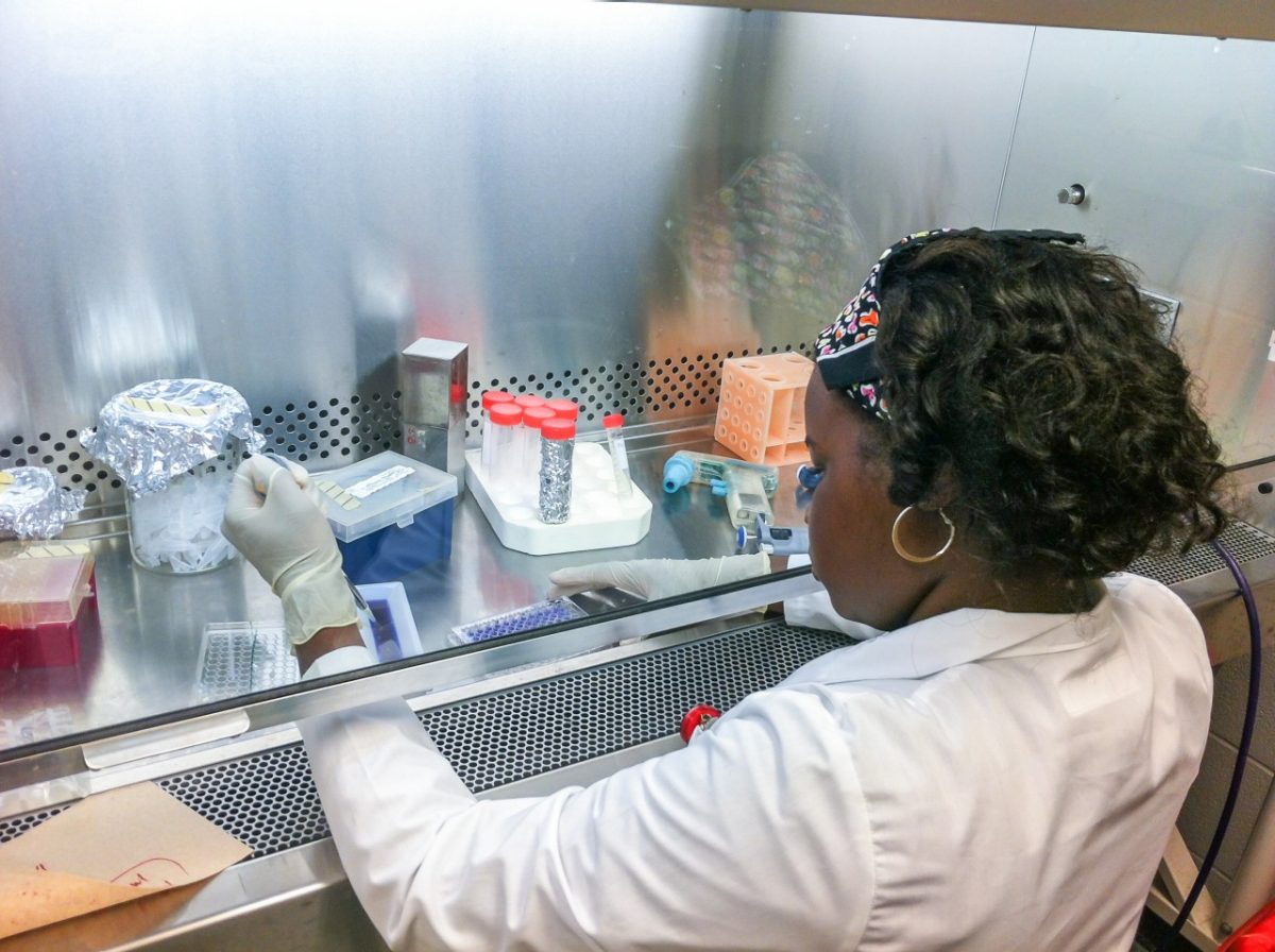 Black woman working with test tubes