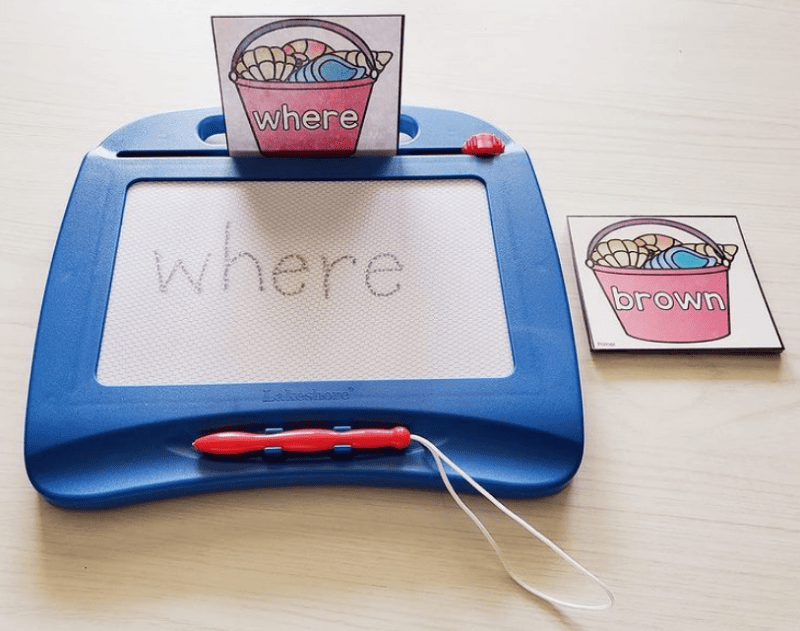 Write words on a magnetic drawing board