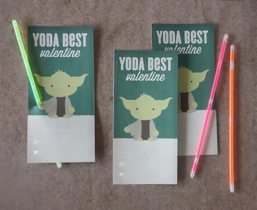 Adorable valentines for students featuring a picture of Yoda and a mini glow stick as a light saber