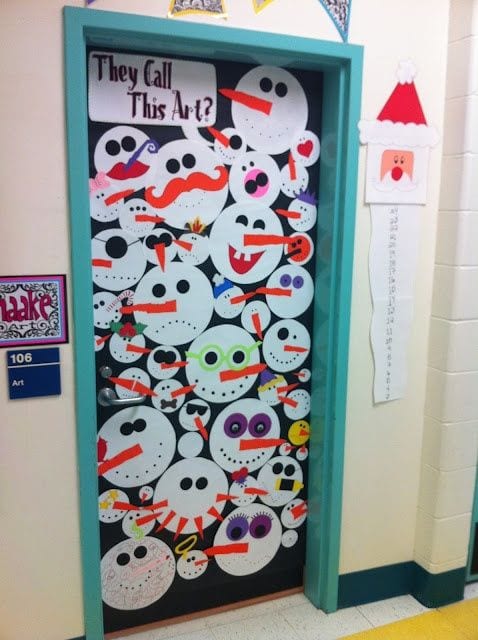 Classroom door decorated with crazy snowman faces. Text reads They Call This Art?