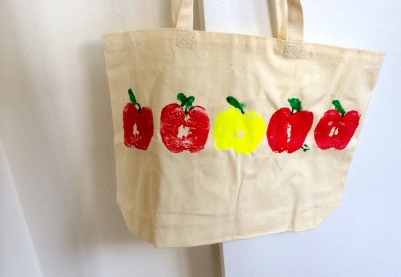 tote bag decorated with apple stamps for a small gift for teachers 