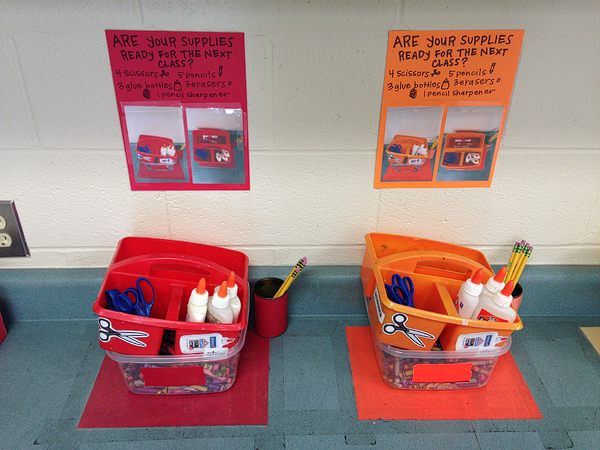 Classroom cubbies can include papers for how to clean-up as shown here. Art supplies are color coded for each student. 