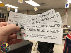 Space-themed classroom decor includes these tickets that say Calling All Astronauts!