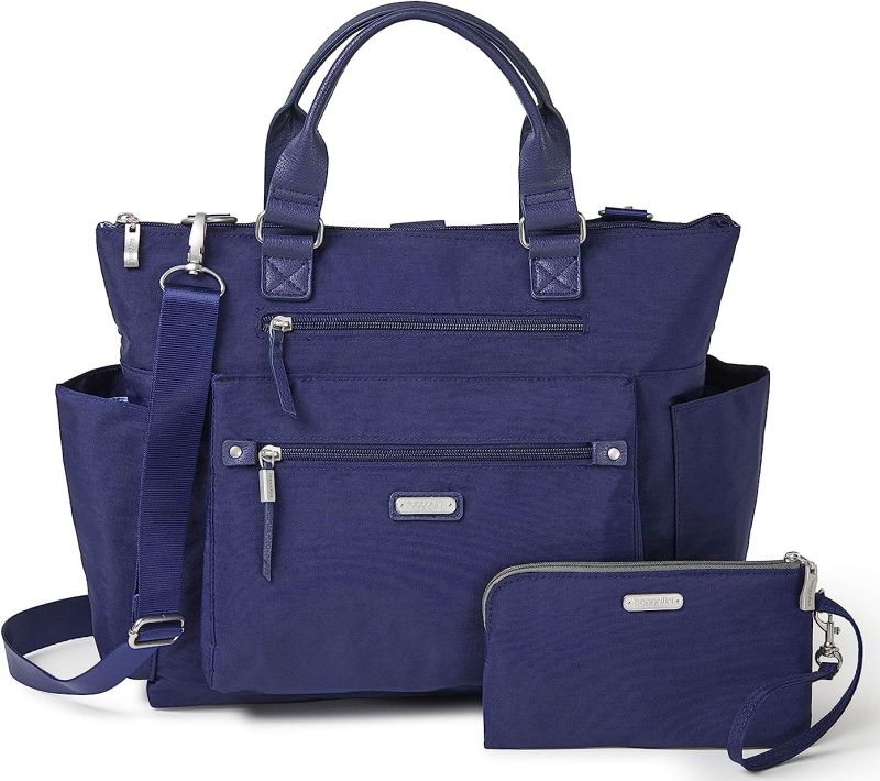 Navy blue tote bag with straps to convert it to a backpack, with a matching wristlet