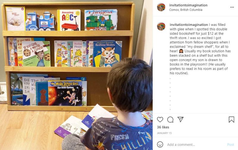 Instagram post showing child reading a book in front of a small wooden bookshelf
