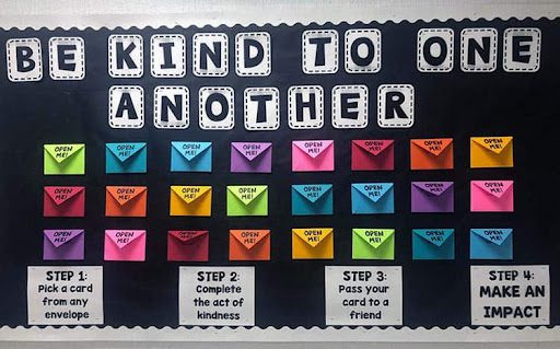 Bulletin board with "be kind to one another" written on it
