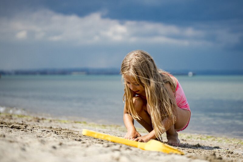 child on the beach, idea for an experience gift 