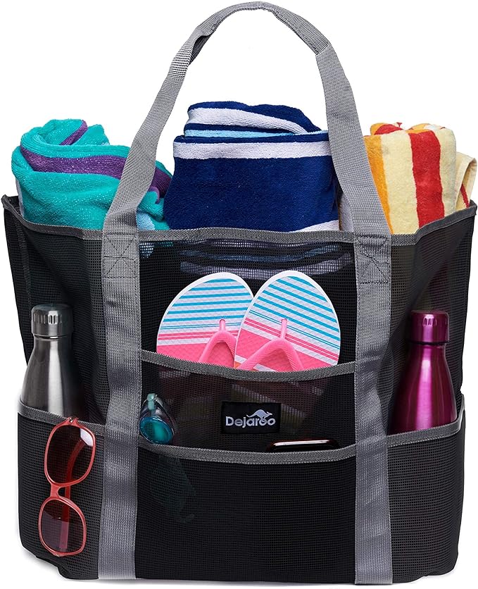 Black mesh beach tote filled with towels, water bottles, flip flops, and more