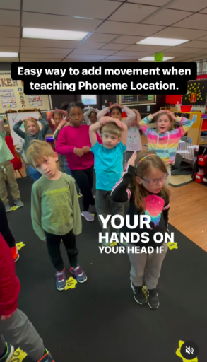 Example of students touching head to show beginning sound