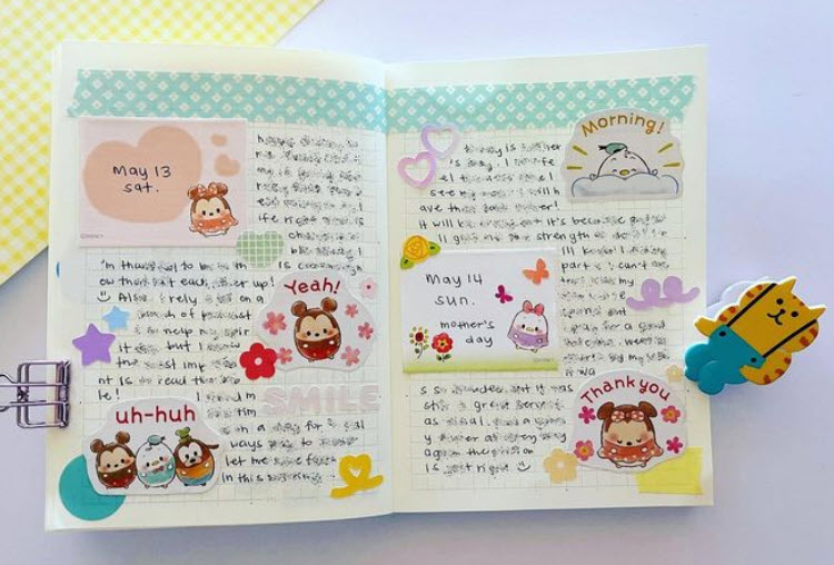 Providing a creative outlet is one of the benefits of journaling, as demonstrated by this double-page spread decorated with drawings and stickers