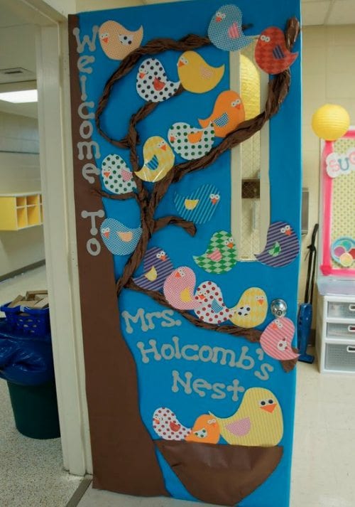 Door decoration of a tree with birds, saying "welcome to Mrs. Holbomb's nest"