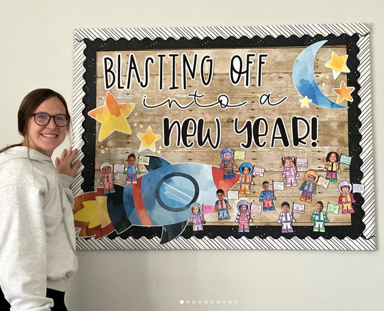 New year bulletin board ideas include this one that says Blasting off into a New Year. It has a rocket ship on it and astronauts whose faces are all of the student's in the class.