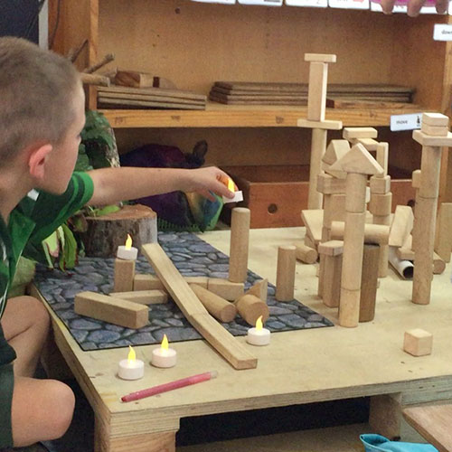 kids playing in a block corner in a play-based learning classroom 