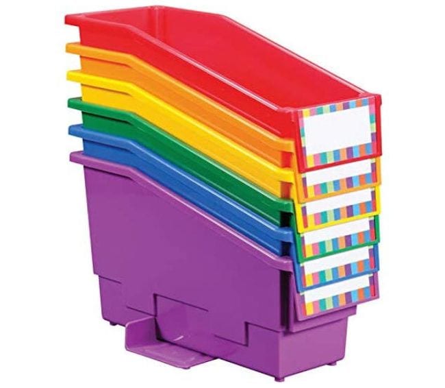 Non-tip book bins in a variety of colors with blank labels