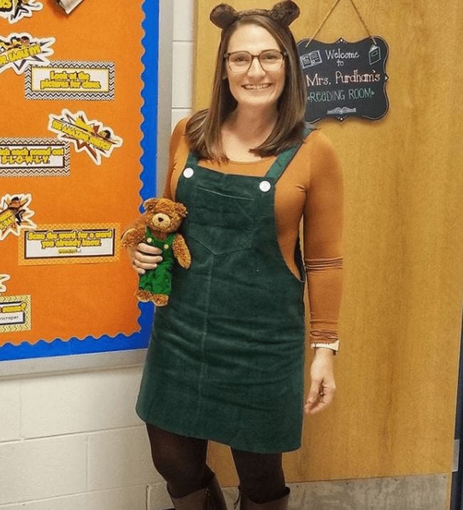 Book character costume ideaslike this one shows a woman wearing green corduroy jumper and teddy bear ears, carrying a matching teddy bear (Book Character Costume Ideas)