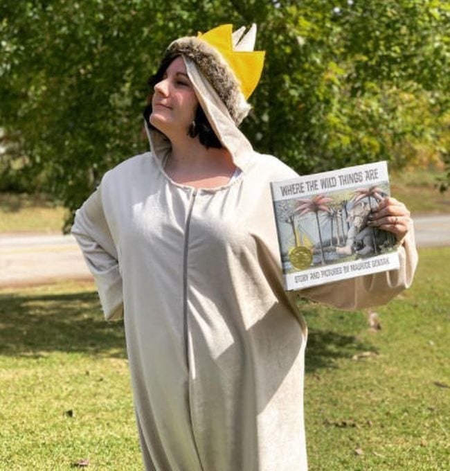 Book character costume ideas like this one shows a woman dressed as Max from Where The Wild Things Are