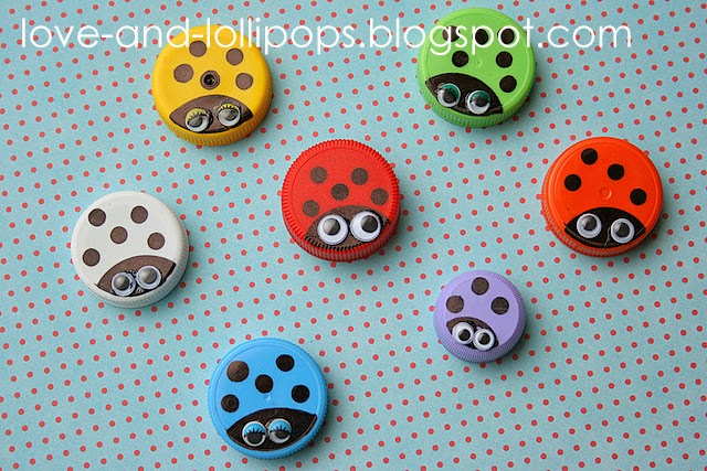 Several bottle caps have been painted different colors and have black dots on them to look like lady bugs. They also have googley eyes.