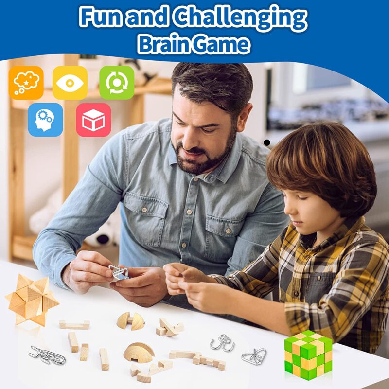 A man and a boy sit working on a variety of puzzles.