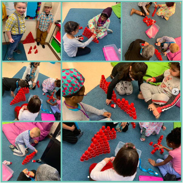 children on the rug building structures with plastic cups