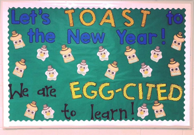 A green background bulletin board says Let's Toast to the New Year. We Are Egg-cited to learn!