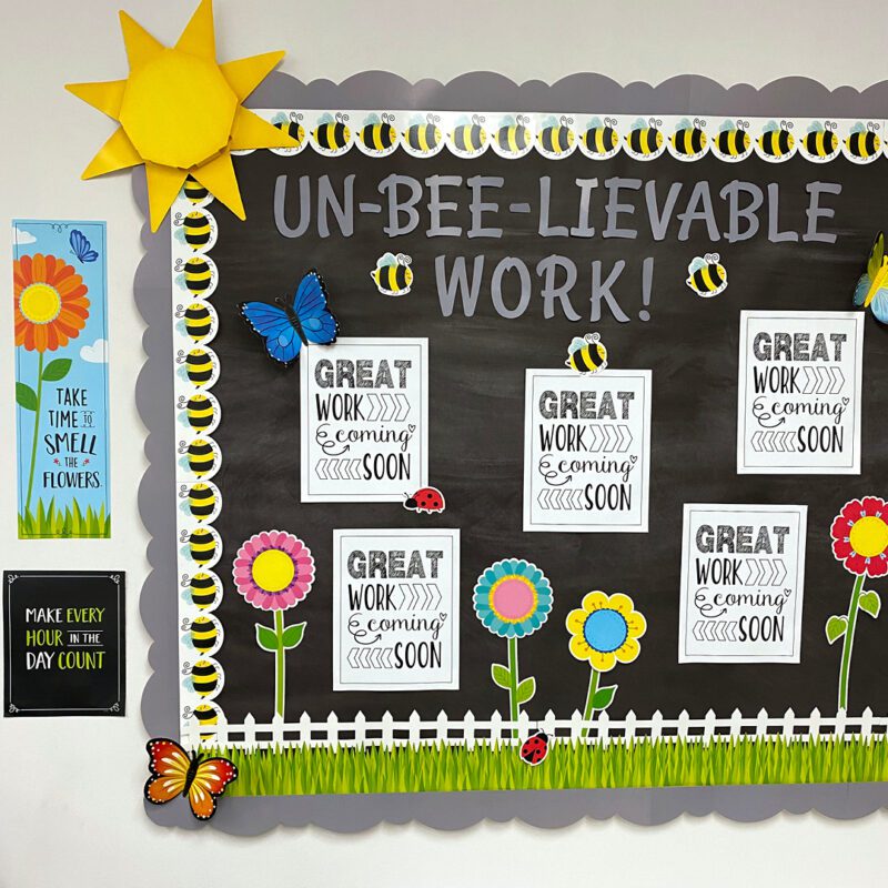 Bumble bee themed classroom bulletin board that says, "Un-Bee-Lievable Work!"