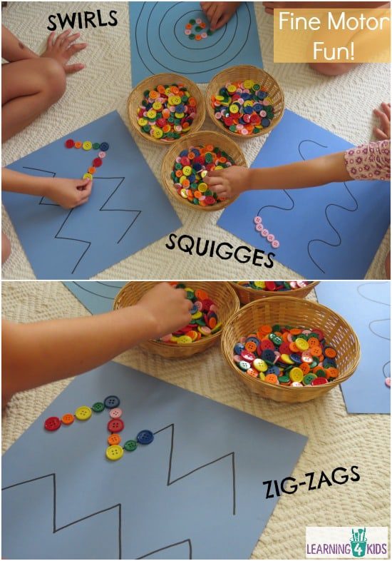 Pieces of blue cardstock have black squiggles and swirls drawn on them. Little hands are seen lining buttons up along the lines. (fine motor activities)