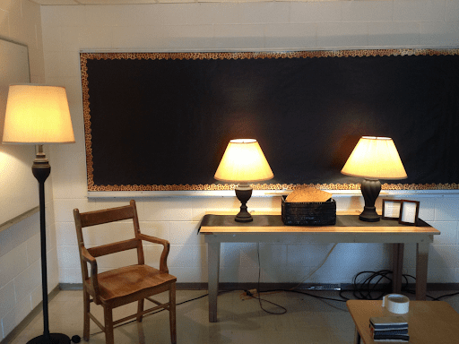 Calming classroom theme can include lighting the two table lamps and one standing lamp shown in this classroom.
