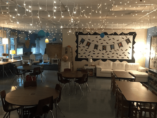 Lighting is important in a calming classroom theme like the warm string lights pictured hanging from the ceiling of a classroom.