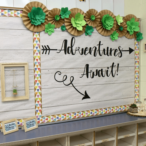 Wall with text reading "Adventures Await!"