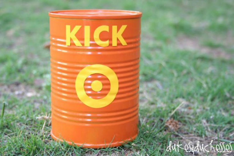 Recess games like kick the can use a can like the orange one shown with a yellow targe and the word kick in yellow on it.