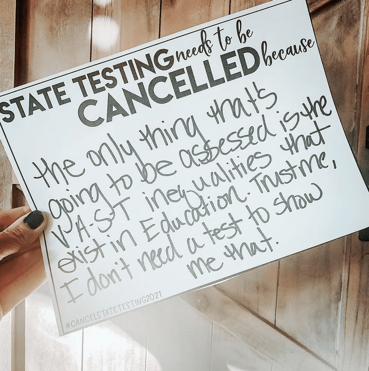 Teacher sign against state testing