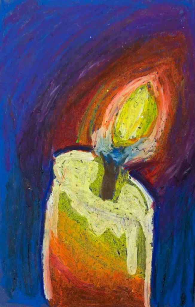 A candle is drawn using oil pastels.