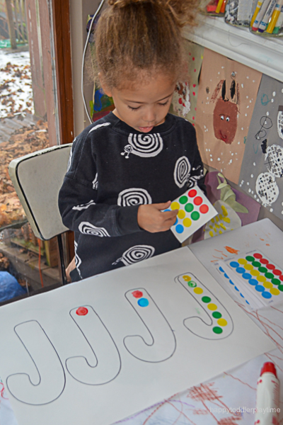 child creating a candy cane pattern 