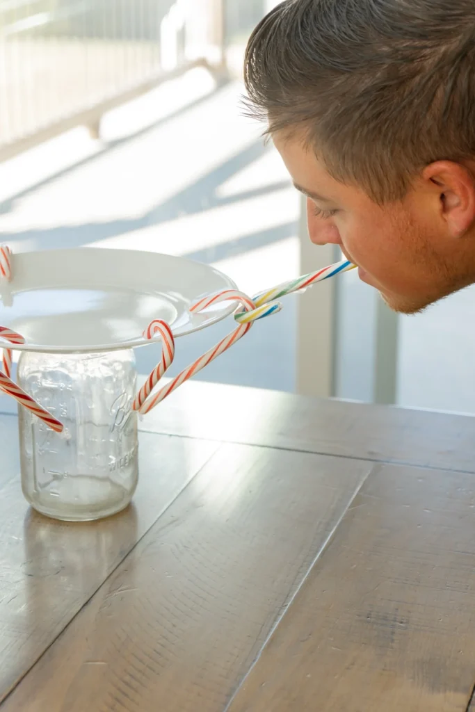 man playing candy cane pond for candy cane games 