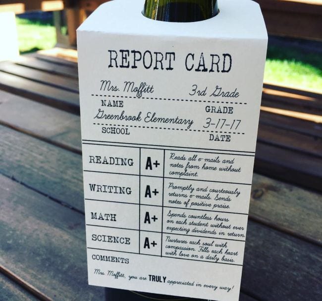 Teacher thank you card made to look like a report card hanging from a bottle of wine
