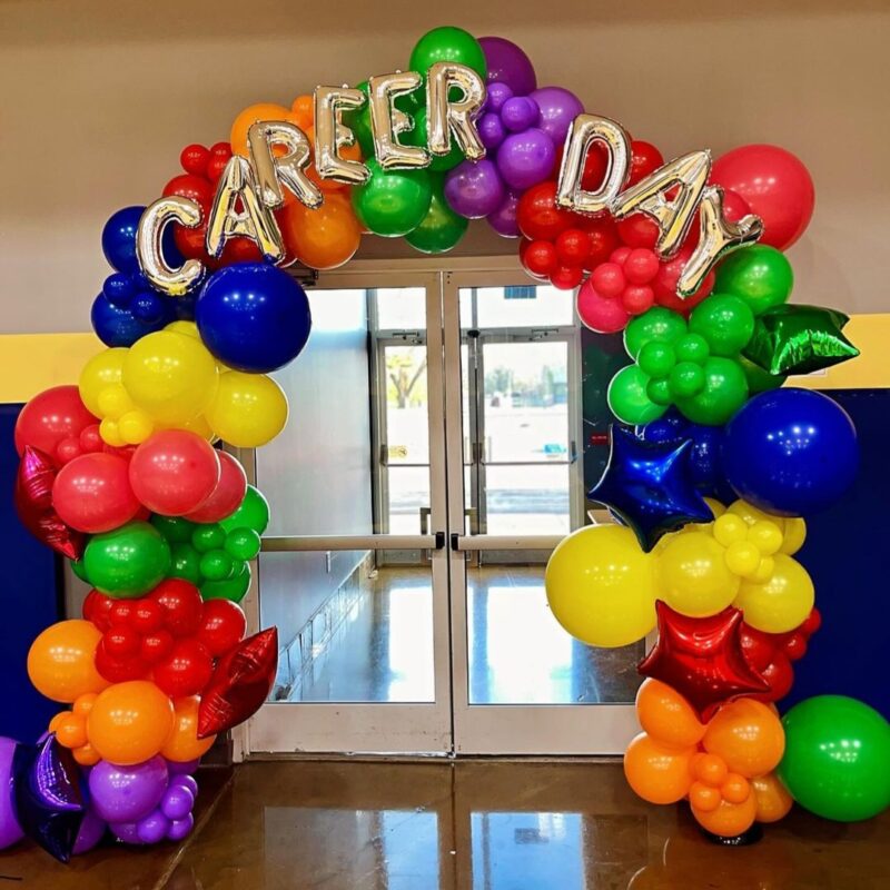 Colorful balloon arch with letters spelling out Career Day across the top