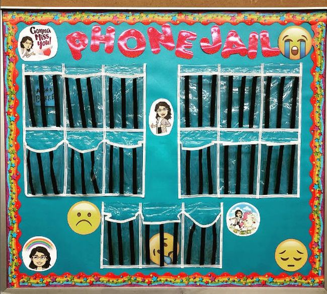 Phone Jail bulletin board with slots for managing cell phones in class