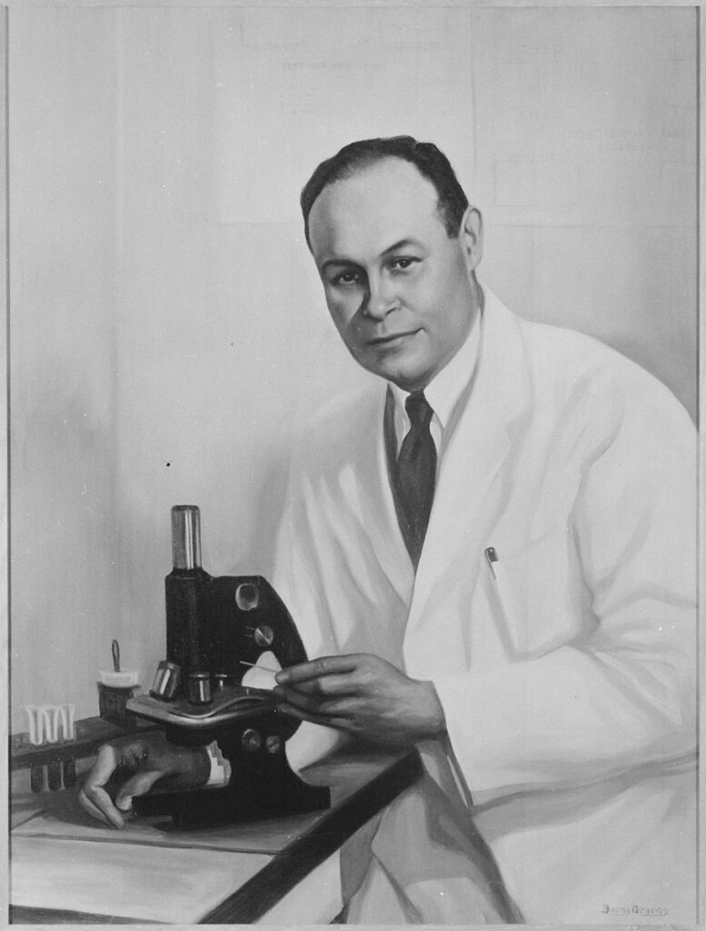 Charles R Drew with microscope