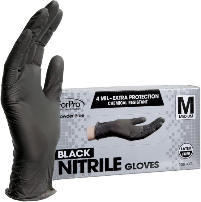 Black nitrile glove next to a box of more gloves as an example of chemistry lab equipment