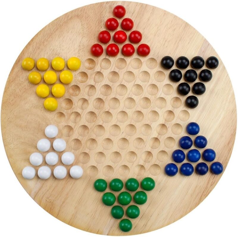 A wooden circle has holes carved in it in the shape of a star. The tips of each point of the star are made from red, black, blue, green, white, and yellow marbles.