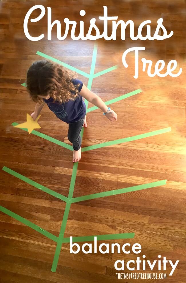 A little girl is balancing along the lines of a Christmas tree which have been created using green painter's tape.