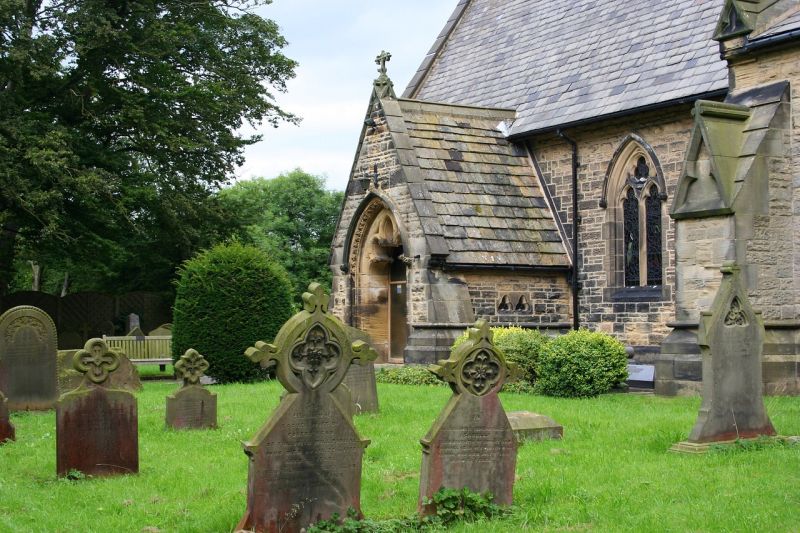 An old graveyard outside a stone church