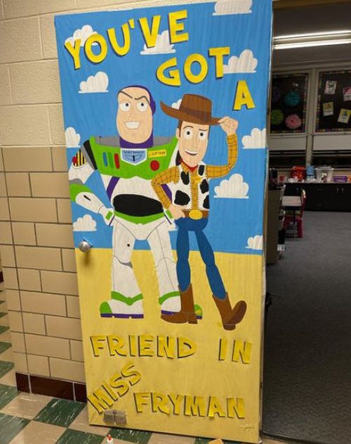 Toy Story-themed classroom door with Buzz and Woody, saying You've got a friend in Ms Fryman